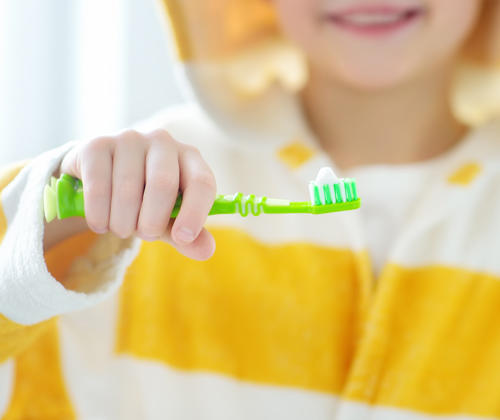Child learning to brush teeth from Geelong children's dentist.