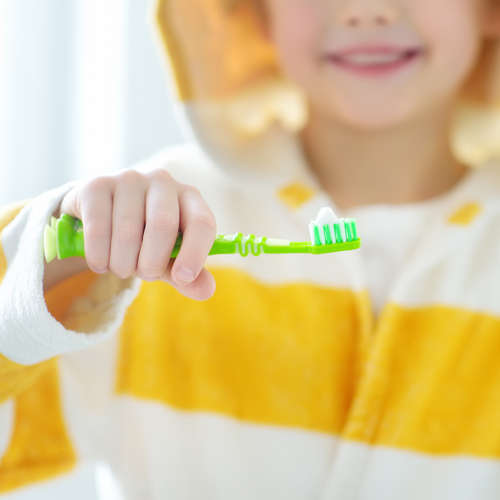 Child learning to brush teeth from Geelong children's dentist.
